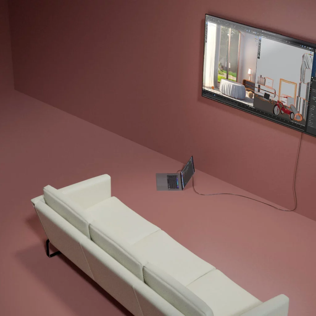 Designersoffa framför tv upphängd på väggen, skärmen visar ett 3D-program